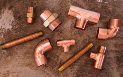 picture of plumbing parts, copper pipe and elbows